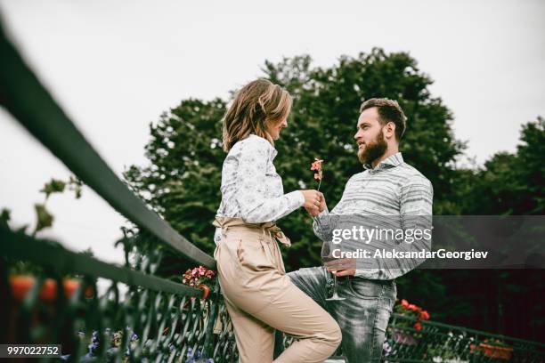 young couple enjoying romantic anniversary on balcony - drunk husband stock pictures, royalty-free photos & images