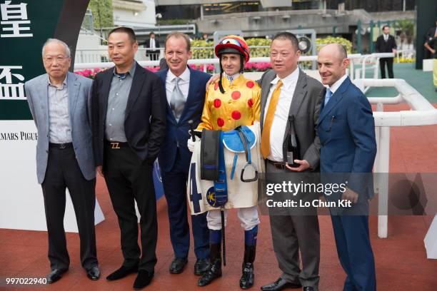 Jockey Douglas Whyte, trainer Richard Gibson and owner Pan Sutong celebrate after Giant Treasure winning Race 9 Audemars Piguet Jules Audemars...