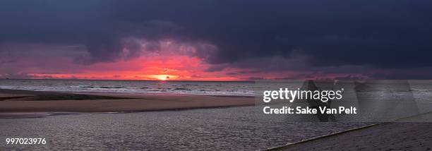 sunset katwijk - katwijk stock-fotos und bilder