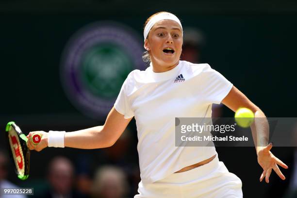 Jelena Ostapenko of Latvia returns against Angelique Kerber of Germany during their Ladies' Singles semi-final match on day ten of the Wimbledon Lawn...