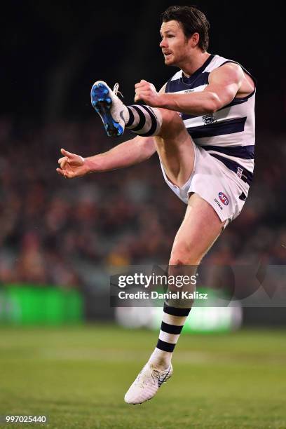 Patrick Dangerfield of the Cats kicks the ball during the round 17 AFL match between the Adelaide Crows and the Geelong Cats at Adelaide Oval on July...