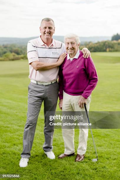 Golf coach and PGA Professional, Mark Stevenson , stands with his oldest student Heinz on the golf course at Gut Rieden golf club in Starnberg,...