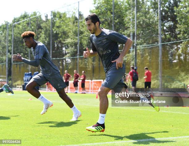 Jeff Reine-Adelaide and Henrikh Mkhitaryan of Arsenal during a training session at London Colney on July 12, 2018 in St Albans, England.
