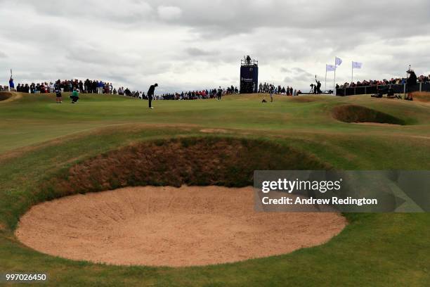 Rickie Fowler of USA chips onto the green, on hole seventeen during day one of the Aberdeen Standard Investments Scottish Open at Gullane Golf Course...