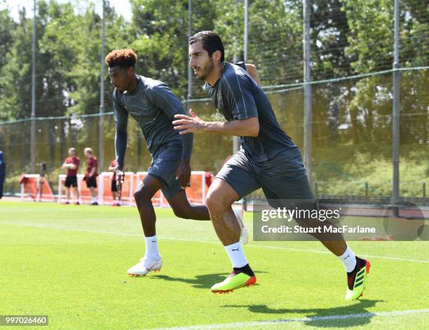 Jeff Reine-Adelaide and Henrikh Mkhitaryan of Arsenal during a training session at London Colney on July 12, 2018 in St Albans, England.