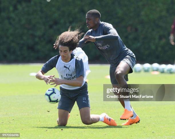 Matteo Guendouzi and Chuba AKpom of Arsenal during a training session at London Colney on July 12, 2018 in St Albans, England.