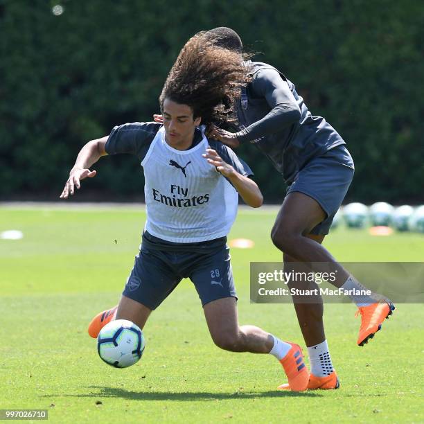 Matteo Guendouzi and Chuba AKpom of Arsenal during a training session at London Colney on July 12, 2018 in St Albans, England.