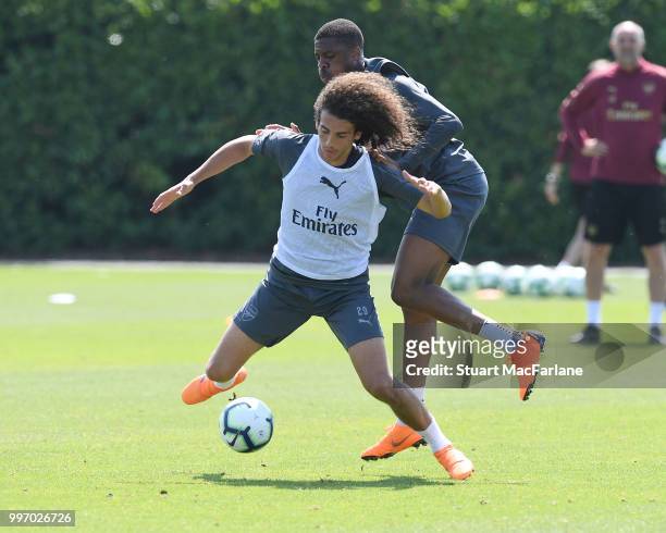 Matteo Guendouzi and Chuba AKpom of Arsenal during a training session at London Colney on July 12, 2018 in St Albans, England.