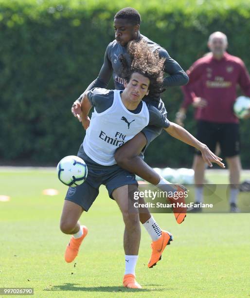 Matteo Guendouzi and Chuba AKpom of Arsenal during a training session at London Colney on July 12, 2018 in St Albans, England.