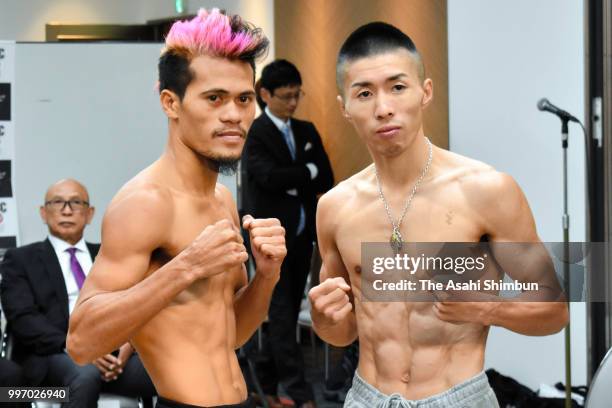 Champion Ryuya Yamanaka of Japan and challenger Vic Saludar of the Philippines pose for photographs after the weigh-in prior to their WBO...