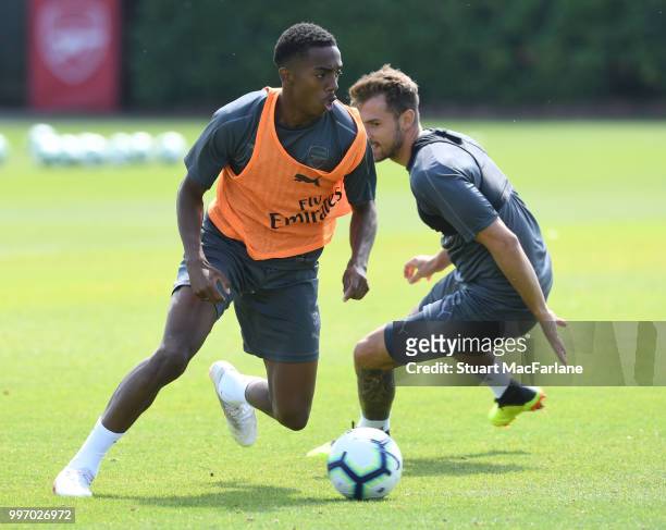 Joe Willock and Aaron Ramsey of Arsenal during a training session at London Colney on July 12, 2018 in St Albans, England.
