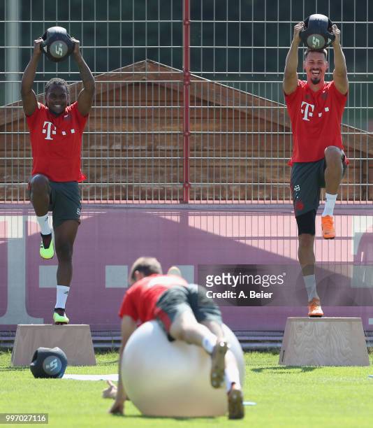 Renato Sanches and Sandro Wagner of FC Bayern Muenchen practice during a training session at the club's Saebener Strasse training ground on July 12,...