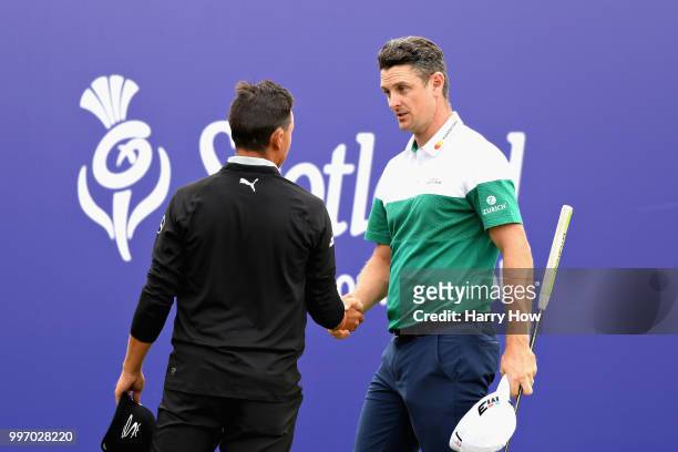 Justin Rose of England and Rickie Fowler of USA shake hands on hole eighteen during day one of the Aberdeen Standard Investments Scottish Open at...