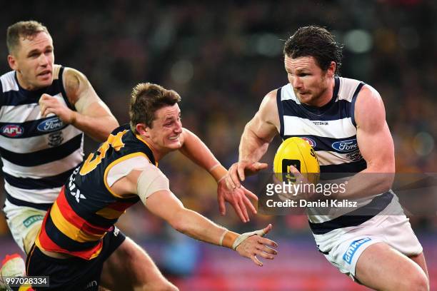Patrick Dangerfield of the Cats runs with the ball during the round 17 AFL match between the Adelaide Crows and the Geelong Cats at Adelaide Oval on...