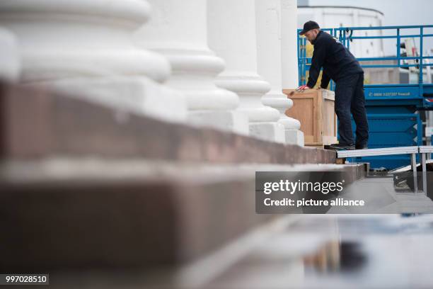 Worker closes a box filled with documenta artwork on a truck in front of the Fridericianum in Kassel, Germany, 6 October 2017. The deconstruction of...