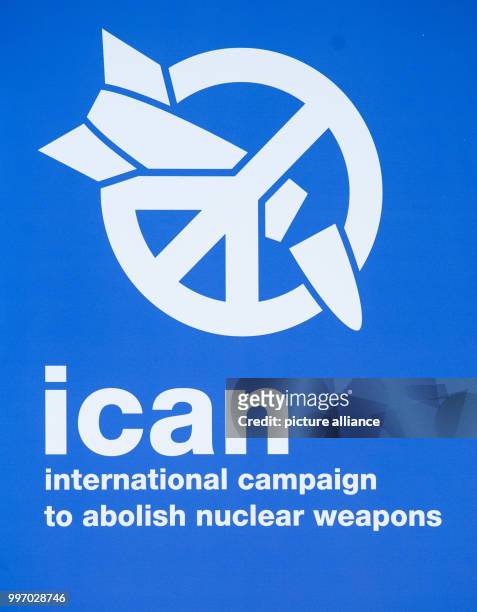 The logo of the "International Campaign to Abolish Nuclear Weapons" can be seen during a press conference regarding the awarding of the Nobel Peace...