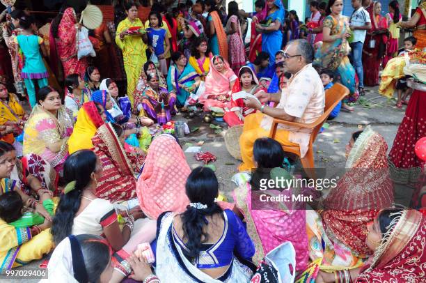 Women assemble for Hindu rituals and puja near Burra Bazar area on June 4, 2016 in Asansol, India.
