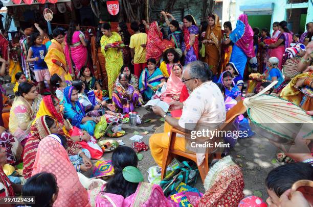 Women assemble for Hindu rituals and puja near Burra Bazar area on June 4, 2016 in Asansol, India.