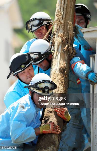 Searching operation continues at a landslide site on July 12, 2018 in Kumano, Hiroshima, Japan. The death toll from the torrential rain in western...