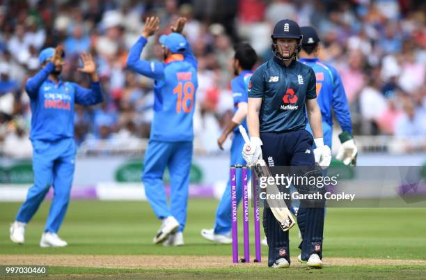 England captain Eoin Morgan leaves the field after being dismissed by Yuzvendra Chahal of India during the Royal London One-Day match between England...