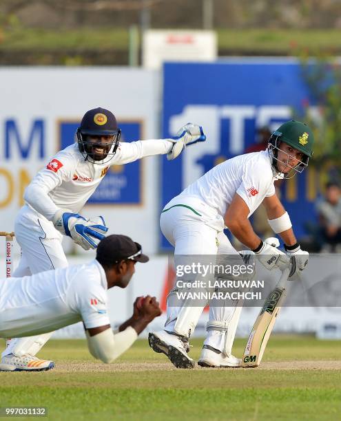 South Africa's Aiden Markram watches as Sri Lankan cricketer Angelo Mathews takes a catch to dismiss him during the first day of the opening Test...