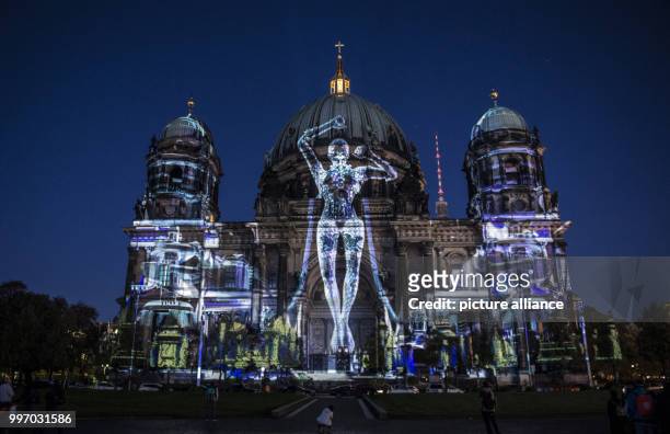 The Berlin Cathedral lit up ahead of the Festival of Lights in Berlin, Germany, 06 October 2017. Photo: Paul Zinken/dpa
