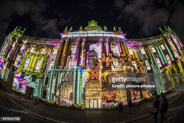 The Law Faculty at the Bebelplatz lit up ahead of the Festival of Lights in Berlin, Germany, 06 October 2017. Photo: Paul Zinken/dpa