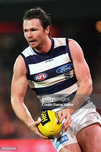 Patrick Dangerfield of the Cats runs with the ball during the round 17 AFL match between the Adelaide Crows and the Geelong Cats at Adelaide Oval on...