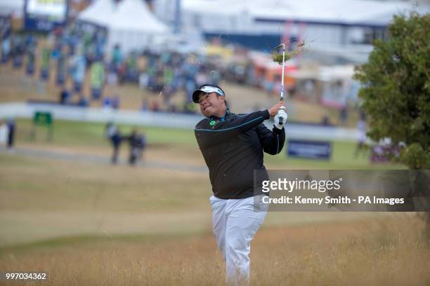 Kiradech Aphibarnrat plays his approach shot from the rough to the 1st green during day one of the Aberdeen Asset Management Scottish Open at Gullane...