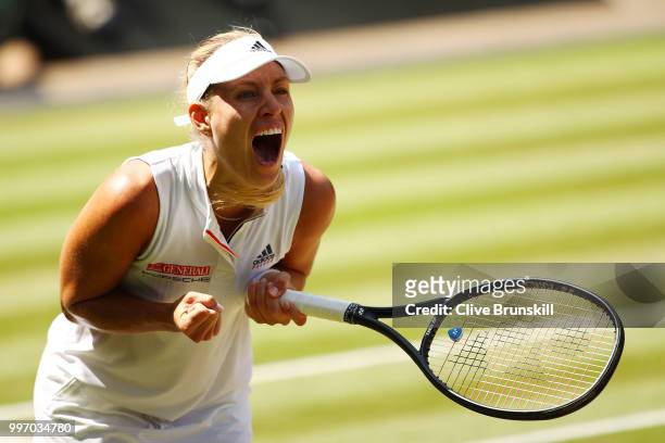 Angelique Kerber of Germany celebrates match point against Jelena Ostapenko of Latvia during their Ladies' Singles semi-final match on day ten of the...