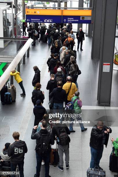 Travellers congregate in the the central train station after a storm caused severe delays in Berlin, Germany, 7 October 2017. The damage inflicted by...