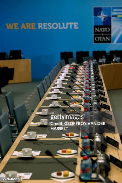 View of cups of coffee and macarons prior to the arrival of leaders, on the second day of the NATO summit, in Brussels, on July 12, 2018.
