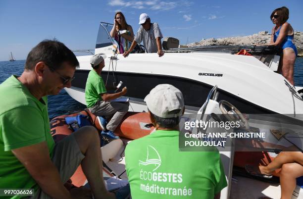 Members of an environmental protection association take part in a campagne called "Zero plastic in the Mediterranean" to raise awareness of...