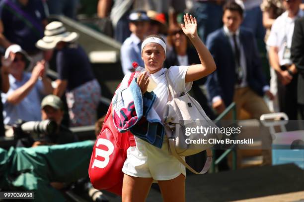 Jelena Ostapenko of Latvia thanks the crowd after being defeated by Angelique Kerber of Germany after their Ladies' Singles semi-final match on day...