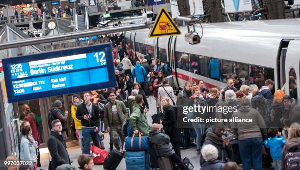 Passengers board a Berlin-bound Intercity Express train in the central station in Hamburg, Germany, 7 October 2017. The damage inflicted by a storm,...