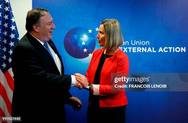 Secretary of State Mike Pompeo and EU's High representative for foreign affairs and security policy Federica Mogherini shake hands ahead of the start...