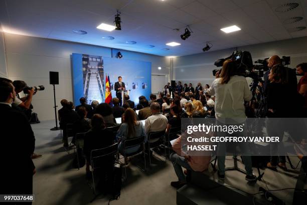 Spain's Prime Minister Pedro Sanchez addresses a press conference on the second day of the NATO summit, in Brussels, on July 12, 2018.