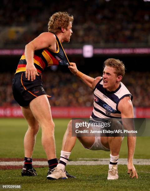 Scott Selwood of the Cats clashes with Rory Sloane of the Crows during the 2018 AFL round 17 match between the Adelaide Crows and the Geelong Cats at...