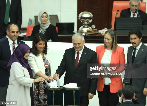 Turkey's last Prime Minister Binali Yildirim and co-Chairperson of Turkey's People's Democracy Party Pervin Buldan from the ruling Justice and...
