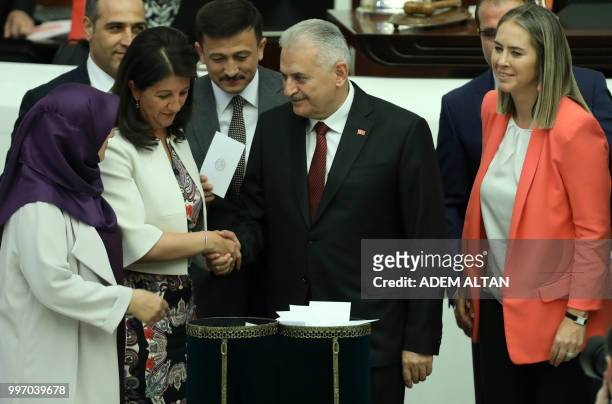 Turkey's last Prime Minister Binali Yildirim and Co-Chairperson of Turkey's People's Democracy Party Pervin Buldan from the ruling Justice and...