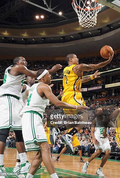Earl Watson of the Indiana Pacers drives the lane against Ray Allen of the Boston Celtics on March 12, 2010 at the TD Garden in Boston,...