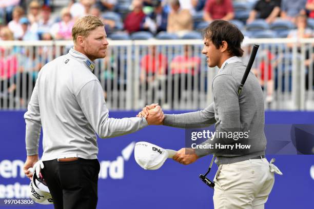 Jens Dantorp of Sweden and Scott Fernandez of Spain shake hands on hole eighteen during day one of the Aberdeen Standard Investments Scottish Open at...