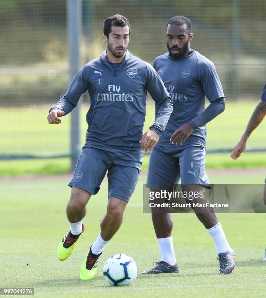 Henrikh Mkhitaryan and Alex Lacazette of Arsenal during a training session at London Colney on July 12, 2018 in St Albans, England.