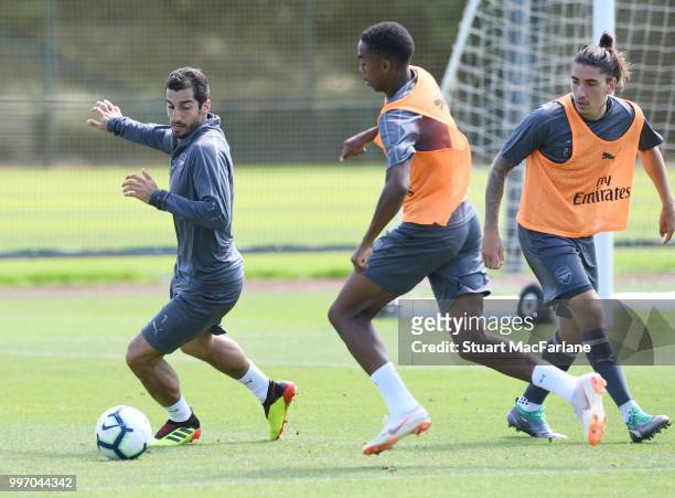 Henrikh Mkhitaryan, Chuba Akpom of Arsenal during a training session at London Colney on July 12, 2018 in St Albans, England.