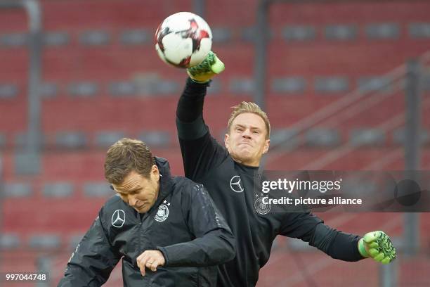 Goalkeeper Marc-Andre ter Stegen and team manager Oliver Bierhoff in action during the final training session before the World Cup qualification...