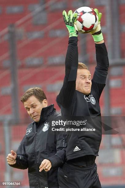Goalkeeper Marc-Andre ter Stegen and team manager Oliver Bierhoff in action during the final training session before the World Cup qualification...