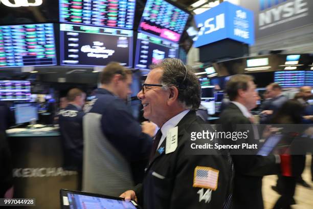 Traders work on the floor of the New York Stock Exchange on July 12, 2018 in New York City. As fears of a trade war eased with China, the Dow Jones...