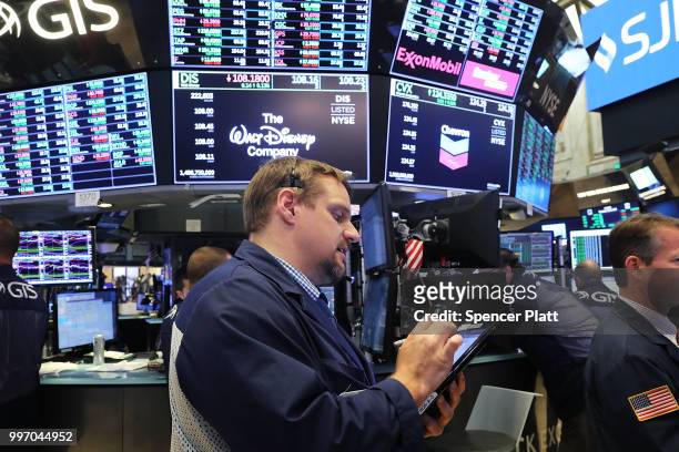 Traders work on the floor of the New York Stock Exchange on July 12, 2018 in New York City. As fears of a trade war eased with China, the Dow Jones...