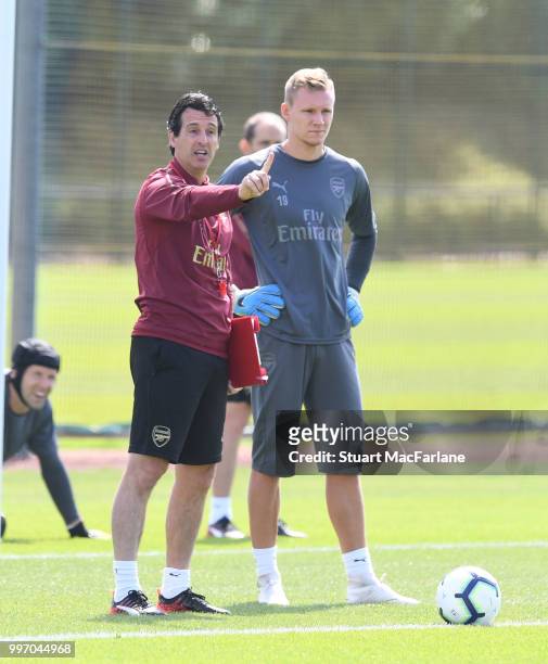 Arsenal Head Coach Unai Emery with goalkeeper Bernt Leno during a training session at London Colney on July 12, 2018 in St Albans, England.