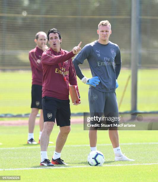 Arsenal Head Coach Unai Emery with goalkeeper Bernt Leno during a training session at London Colney on July 12, 2018 in St Albans, England.